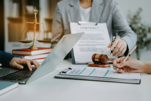 Divorce lawyer having team meeting with client, Law and Legal services concept in office.